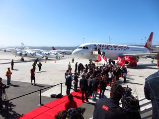 Virgin Territory: Richard Branson - Photo 2 of 4 - Virgin America is welcomed to its new home at SFO's Terminal 2 by Virgin Galactic's WhiteKnightTwo and a gaggle of press.