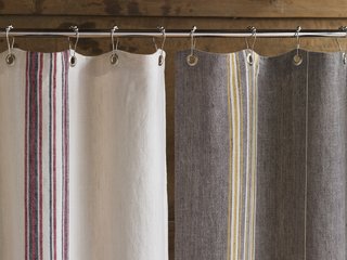 Among Wegman's latest designs are shower curtains and duvet covers made of soft, slubbed linen with yarn dyed stripes.