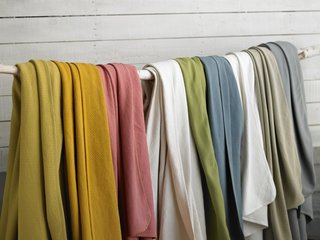 The new Basket Weave Blanket is jacquard woven of pure organic cotton, bound with percale. It's also machine washable.