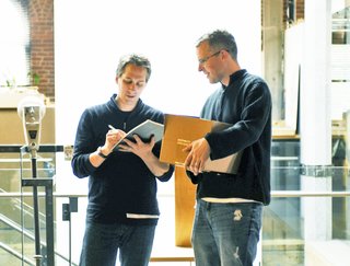 Craig Brooks, director of the Maxon House film (left), and author Lou Maxon (right) discuss tactics for the afternoon's filming session.