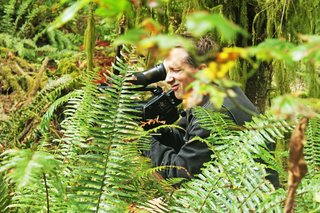 Director Craig Brooks gets in the brush to capture close-up action of site preparation work for the Maxon House documentary.