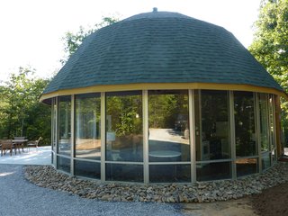 The storefront windows were less expensive than residential windows and provide guests with views to the grand outdoors beyond.