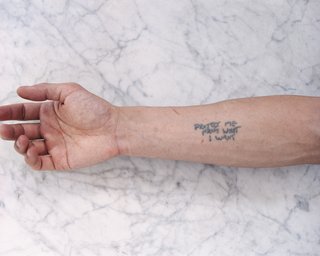 Tobias Wong, Protect Me From What I Want, 2002; artist tattoo; © Estate of Tobias Wong. Photo courtesy SFMOMA.