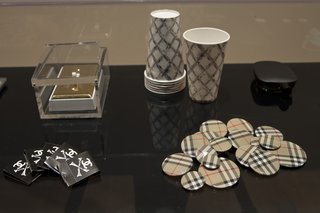 Another selection of objects on display including Unauthorized Burberry Buttons (1999). Burberry took to Wong's shenanigans and used the pins in one of their advertising campaigns. Photo courtesy SFMOMA.