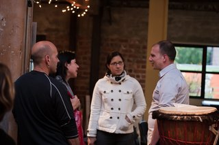 During pre-discussion drinks, Halbrecht chats with attendees in REBAR's studio space. Photo by Søren Schaumburg.