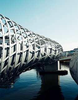 Exploring Melbourne, Australia - Photo 12 of 25 - The Webb Bridge in Docklands is a curving footbridge designed by Melbournian superfirm Denton Corker Marshall. It's meant to evoke an aboriginal eel trap.