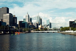 Exploring Melbourne, Australia - Photo 23 of 25 - Looking east from the Kings Way Bridge over the Yarra you can see the yellow tower of Flinders Street Station and the points of St. Paul's Cathedral beyond.