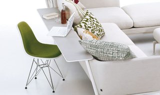 Adding a mounted shelf onto the back of the sofa creates a compact work space—or a spot for snacking. Just don't bump your soda bottle or wine glass...