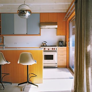 Long Island Found - Photo 1 of 12 - A Mirror Ball pendant by Tom Dixon hovers over the kitchen counter.