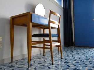 Our room was also outfitted with this custom designed desk with attached mirror and an iconic Superleggera chair.