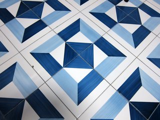 By rotating the individual tiles, this pattern alone could create four distinct layout configurations.