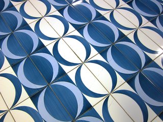 In this tessellation, crescent moons form circles.