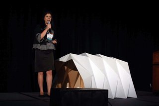 From the Show Floor: Pecha Kucha - Photo 3 of 7 - Tina Hovsepian explains her Cardborigami prototype.