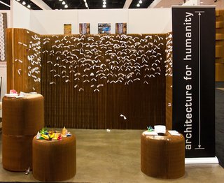 This photo, by Barry Schwartz, is of Architecture for Humanity's booth at Dwell on Design. The wall is by Molo and the tiny white slips of paper are wishes affixed thereto.