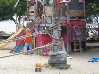 The standard kit of Adventure playgrounds is an assembly of recycled scraps—tires, boards, paint—which the children are allowed to manipulate as they wish, using simple tools. There is usually sand, water, and mud play, and some adventure playgrounds also incorporate small animal husbandry and cooking over an open fire or in an outdoor oven. Adventure Playgrounds also employ adult playworkers dedicated to ensuring the safety of the children without getting in the way, and studies show that accident rates at Adventure Playgrounds are actually lower than those at conventional playgrounds. Fastidious Parent Alert: expect your kids to get dirty here!<br><br>Photo by Susan Solomon