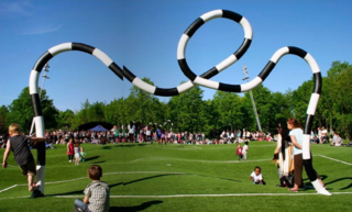 "Puckelball" is a variant of soccer played on a field that looks like it was attacked by giant moles with a goal designed by the Mad Hatter. Its creator, artist Johan Strom, thinks of it as a metaphor for life: <br><br>"Many live under the belief that life is a fair playing field, that both pitch halves are just as big and the goal always has at least one cross. But ultimately the ball never bounces exactly where you want it to and the pitch is both bumpy and uneven." The world's only Puckelball pitch is in Malmö, Sweden, a city with many other great playgrounds and public spaces as well. Definitely worth a trip!
