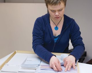 In the color-selection room, Taina Tiilikainen thumbs through swatches to help designers pick the perfect combinations