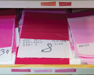 The recipe for each color is attached to its corresponding fabric swatch, and after the designer chooses the right combination, the recipes are sent to the color kitchen. Some colors, such as beige and gray tones, are more difficult to produce than others; turquoise is notorious for sticking poorly to fabrics. "We have our trade secrets that ensure that the colors work," says Anu-Mari Salmi, the production manager.