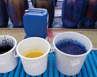 The inks are stored in plastic wrap–covered buckets, which prevents a thick, top layer from forming. Each day, the color kitchen prepares hundreds of pounds of ink for the hues needed for the following day’s printing. "Thanks to having our own facilities, we can react quickly to sales," Salmi says.
