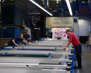 The more complex the design and the more colors used, the more plates—and hands (up to four professionals at a time)—are required to run the 80-foot-long printer.