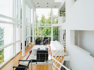 Michael McCarthy and Marcia Myers spent years rehabilitating the Douglas House, built in 1973 and one of Meier's first major residential commissions. The double-height living room features a custom sofa and low table of Meier’s design. Read the full story from our October 2011 issue here.
