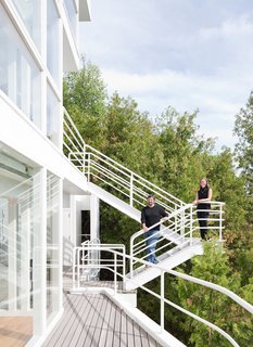 This Lake House Is a Living Piece of Architecture History - Photo 10 of 21 - Michael McCarthy and Marcia Myers on the exterior promenade.