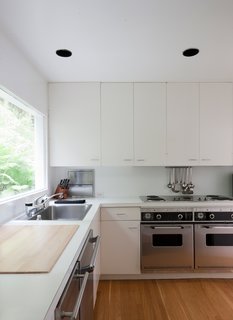 This Lake House Is a Living Piece of Architecture History - Photo 18 of 21 - The "Meier white" extends even to the kitchen, which has been updated with new appliances.