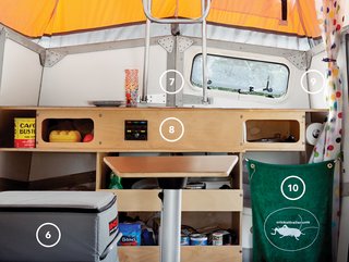 The interior is surprisingly spacious despite being jam-packed with features, like a 43-quart-capacity fridge (6), a built-in sink with a hinged cover that folds down flush with the laminate countertop (7), power switches and outlets (8), a handheld shower and curtain (9), and a self-contained portable toilet (10).