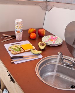 The refrigerator hummed through the night (and woke me up several time) but it did keep the cheese and lunch meet cold.
