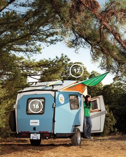 Although Finney believes that when you're camping "you're supposed to leave your house and its comforts at home," the Cricket's canopy (17) lends the trailer a homey feel while providing a triangle of shade. The back pops open to provide easy access to the under-bench storage and to bring in a breeze (16).
