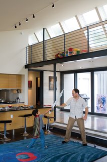 The thick peacock rug from CB2 offers a cushioned surface for energetic play.
