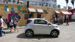Despite its diminutive appearance, the iQ seats four and is especially roomy up front.