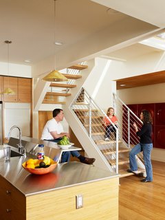 The countertops in the kitchen are a mix of quartz surfaces and custom and salvaged stainless steel. "We use the kitchen all of the time, it turned out really nice," says Melissa. "It's very open, certainly one of the central focuses of the house, and is fun for entertaining."