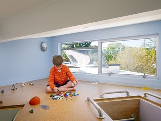 Both of the children have access to the playspace, which has cork flooring. "Rian and Melissa thought, "How do we want to live our lives? How can the shape of the house create the backdrop for how we live and interact, and how our kids will grow up?" says Feldman. "They were really proactive and I think that's how we created this really special place."