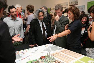Shaun Donovan, Jeanne Gang, and Mohsen Mostafavi, Dean of the Harvard Graduate School of Design, present Studio Gang's proposal for the exhibition.