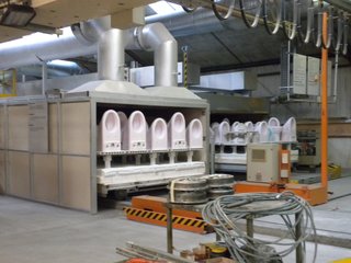 The ceramics are fired in a 340-foot-long, 2,200-plus-degree kiln. The sinks, toilets, and tubs are tinted either pink or blue from the glazing but come out a pure white on the other side.