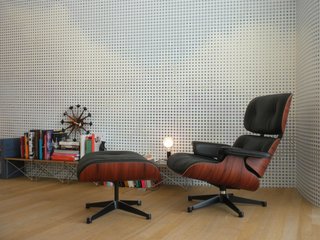 On another floor, this tranquil scene features Charles and Ray's lounge chair as well as the couple's Wire Base Side Tables.