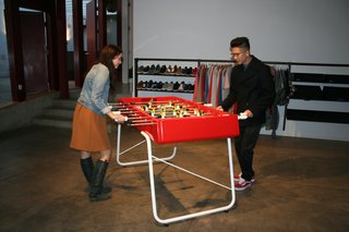 Guests at the event face off on one of RS Barcelona's new foosball tables.