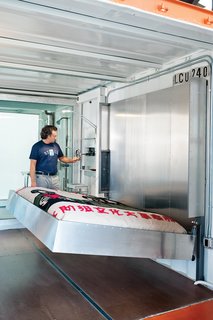 Furniture designer Pat Carson created a plethora of custom fixtures for this guest room, including a riveted aluminum Murphy bed. The best Murphy beds raise and lower easily, often requiring only one hand. This unique wall bed employs a hand-cranked wheel-and-pulley system.
