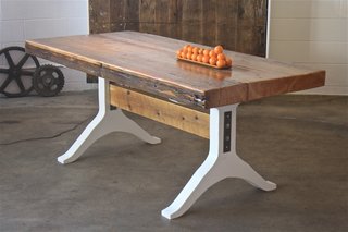 Denver's Fin Art Co. - Photo 2 of 5 - One of McGowan's favorite pieces is this dining table. "We found a 4.5-inch-thick old growth pine beam that was once used to support an 1800's building. We mounted it on white lacquered MDF legs to draw tension between the overly thick top and the glossy wishbone base," he says.