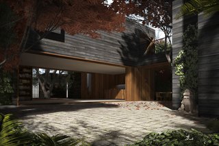 A view across the main courtyard into the great room and beyond to the pine needle courtyard. The great room houses the living, dining and kitchen spaces and can be opened to the outdoors on both sides. A lift and slide door system on the western wall creates the largest opening in the house, looking onto the main courtyard.
