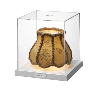 Like many of Gilad's designs this light combines wit and aesthetic, with the abstract and the functional. The fabric shade seemingly floats in an acrylic box, and is lit by a halogen lamp creating diffused light.