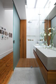 To help disperse light in the newly opened-up interior, the designers clad the roof over the guest bathroom with Danpalon, a translucent polycarbonate that brings in lots of softened natural light. The walls and door are frosted glass. Says Kyprianou: "You can’t see much through the glass – just silhouettes – so our guests don’t mind!"