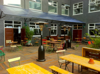 Shielded from the Atlantic wind, this cozy patio is a popular hangout for visitors and locals alike.