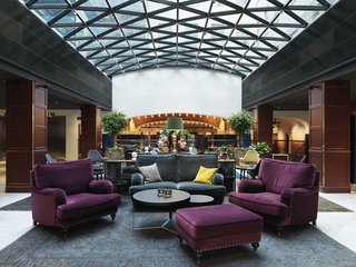 The hotel is in a building that dates from 1885. Here's the lobby, which is outfitted with comfortable couches and Eames/Saarinen Organic chairs (you can make out a couple of the chartreuse and grey beauts in the background).