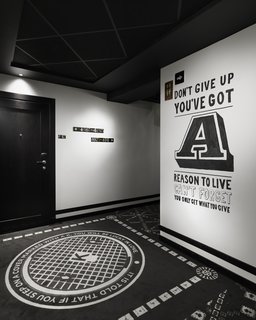 The interiors are by local firm Koncept. While the lobby is a mix of rich colors and textures, the corridors are monochromatic with quotes emblazoned on the walls. The patterns on the carpet are inspired by Stockholm's manhole covers.