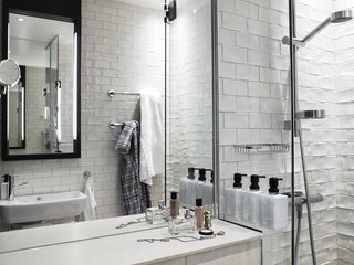 The bathrooms are crisp and uncluttered with toiletries by Face Stockholm. Scandic (like Sweden in general) has a strong environmental commitment. The bathrooms have dual-flush toilets (pretty standard in Europe), larger pump bottles rather than single-use throwaways for shampoo and soap, and a sign that says "80 percent of guests reuse towels." Nothing like the bandwagon effect to motivate people to be more conscious of the resources they use! On a related note, you have to insert your key card into a socket to turn on your room's lights. Not only does it ensure that the lights will be off when you depart, your card will always be right next to the door—great for those (such as myself) who frequently misplace small things.
