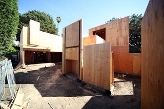 Here's a shot looking east from the garage towards the main living room with its large door opening. On the right is the master bedroom courtyard. The box shown under the H-shaped steel members will eventually be a fireplace from Spark Modern Fires