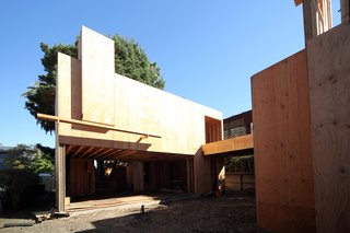Here's a view of the living room showing a large opening onto the main courtyard. The opening is where our big lift and slide door system from Archispec will be installed.
