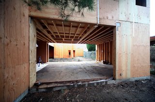 A view from the Pine Needle courtyard through the living/dining room to the main courtyard beyond.